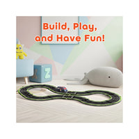 Toy race track set up on a playroom floor with text reading "Build, Play, and Have Fun!".