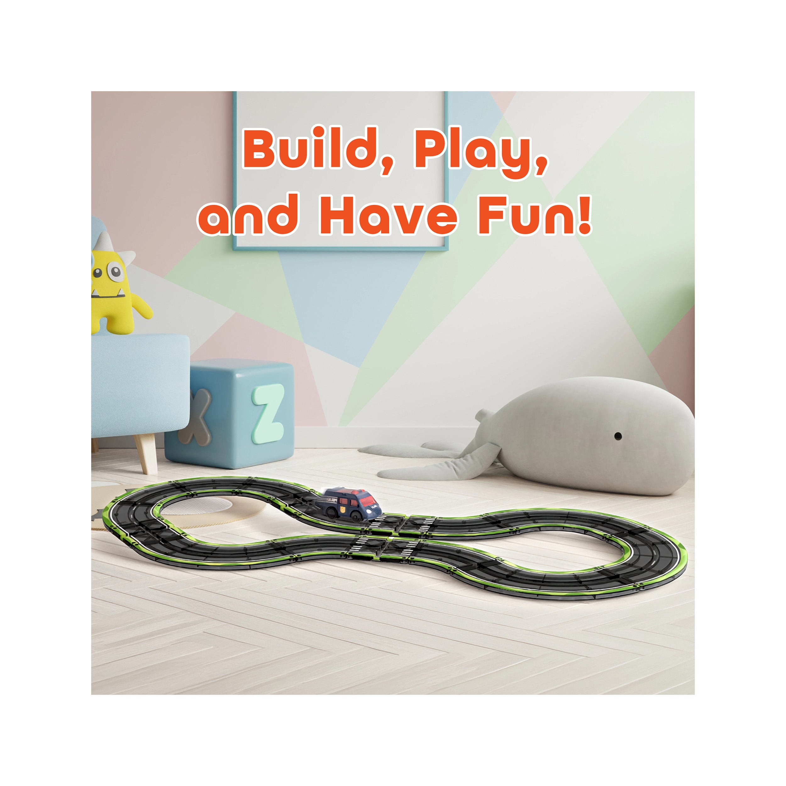 Toy race track set up on a playroom floor with text reading "Build, Play, and Have Fun!".