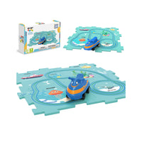 Ocean puzzle track play set featuring a blue watercraft toy, sea creature puzzle mat, and packaging box.