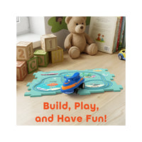Blue ocean puzzle track set on a wooden surface with teddy bear, wooden blocks, and text reading "Build, Play, and Have Fun!".