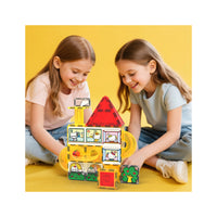 Two girls playing with a yellow Hello Kitty magnetic marble run against a bright yellow background.