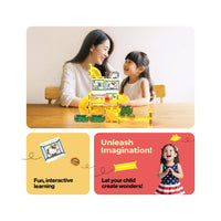 Mother and daughter playing with a yellow Hello Kitty marble run next to an "Unleash Imagination!" banner.