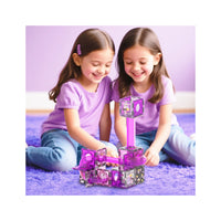 Two girls playing with a purple Kuromi magnetic marble run track on a fluffy purple rug.