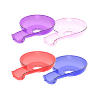Four translucent funnel-shaped plastic track pieces in purple, pink, red, and blue
