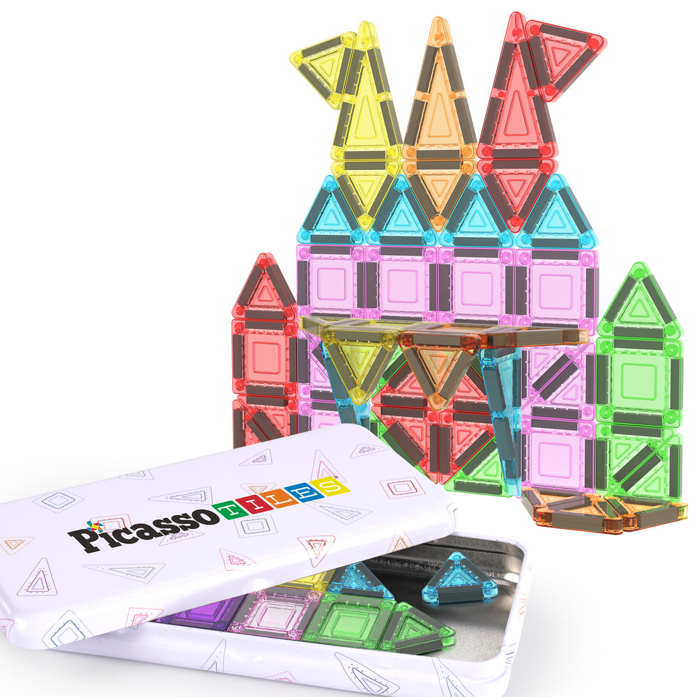 PicassoTiles mini magnetic travel set with colorful translucent tiles stacked into a castle next to its storage tin.