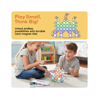 Children building a nano magnetic tile castle beneath a "Play Small, Think Big!" promotional banner.   