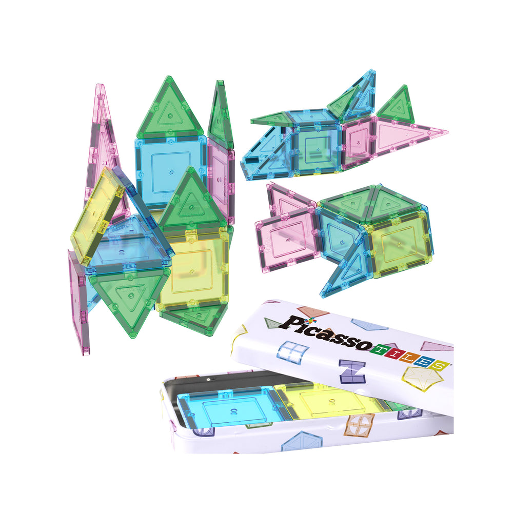 Translucent magnetic tiles assembled into different shapes next to a white storage tin