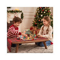 Girl and boy playing with gingerbread hose and characters
