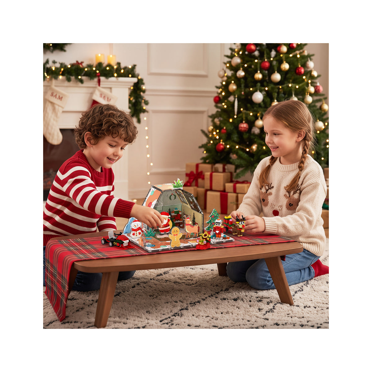 Girl and boy playing with gingerbread hose and characters