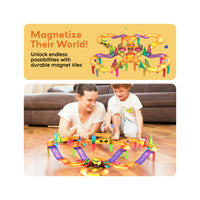 Mother and child playing with a magnetic race track playset on the floor below "Magnetize Their World!" banner.