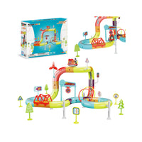 PicassoTiles tubular race track train playset featuring a multi-level looping track, motorized train, bridge, road signs, and packaging box.